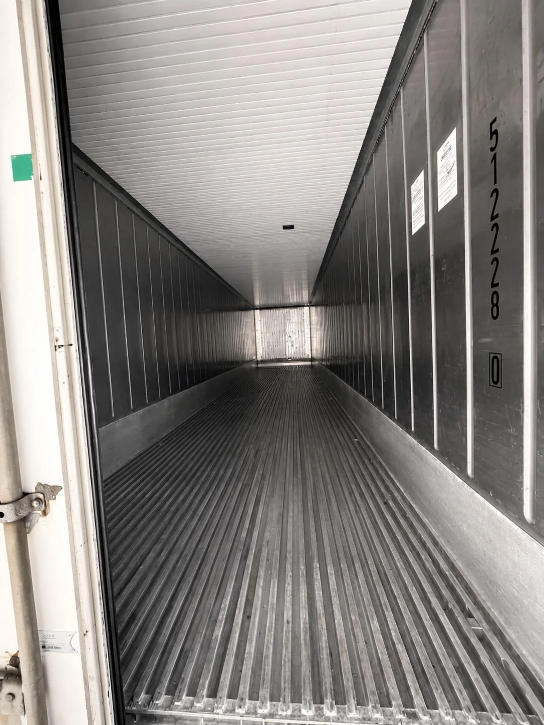 Refrigerated shipping container interior with cold chain systems